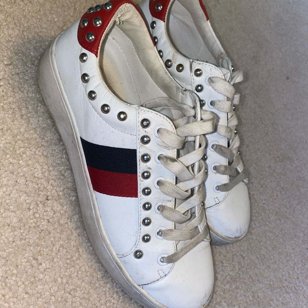 Red and black striped Steve Madden sneakers